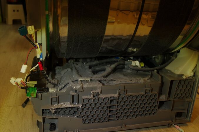 Lint packed into the base duct under the drum, all the way to the grille